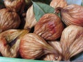 Autumn fruits . Closeup of dried figs with leaves