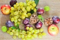 Autumn fruits, cone, chestnuts, plum, grapes, apple and leaves o Royalty Free Stock Photo