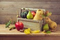 Autumn fruits and pumpkin on wooden table. Thanksgiving dinner Royalty Free Stock Photo