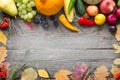 Autumn fruits and vegetables on a retro wooden background with leaves Royalty Free Stock Photo