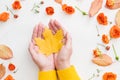 Autumn fun fall yellow maple leaf hands rose buds Royalty Free Stock Photo