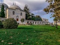 Autumn Garden of the Suleymaniye Mosque in Istanbul Turkey. Bright green grass on the lawn and yellowed leaves of trees against Royalty Free Stock Photo