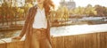 Elegant woman on embankment in Paris looking into the distance Royalty Free Stock Photo