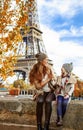 Mother and child travelers playing on embankment in Paris Royalty Free Stock Photo