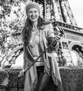 Tourist woman with selfie stick on embankment near Eiffel tower Royalty Free Stock Photo