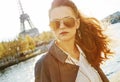 Young woman on embankment in Paris looking into the distance Royalty Free Stock Photo