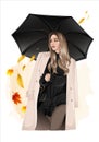 autumn girl with a black umbrella in orange leaves Royalty Free Stock Photo