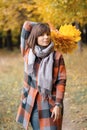 Autumn girl walking in city park. Portrait of happy lovely and beautiful young woman in forest in fall colors. Royalty Free Stock Photo