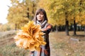 Autumn girl walking in city park. Portrait of happy lovely and beautiful young woman in forest in fall colors. Focus on Royalty Free Stock Photo