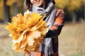 Autumn girl walking in city park. Portrait of happy lovely and beautiful young woman in forest in fall colors. Focus on Royalty Free Stock Photo