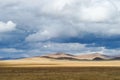 Autumn grassland, all over the sky of clouds,Light and shadow of the sun Royalty Free Stock Photo