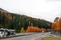 Autumn green and yellow forest over highway