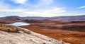 Autumn greenlandic orange tundra landscape with lakes and mountains in the background, Kangerlussuaq