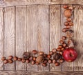 Autumn harvest. Apple and nuts on the wooden table Royalty Free Stock Photo