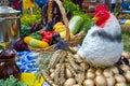 autumn harvest holiday background, hen on eggs, ears and vegetables