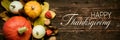 Autumn Harvest and Holiday still life. Happy Thanksgiving Banner. Selection of various pumpkins on dark wooden background.