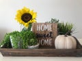 Autumn harvest, natural products, Greeting card concept. Still life with beautiful sunflowers in vase, sliced white bread on clay Royalty Free Stock Photo