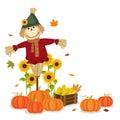 Autumn harvesting with cute scarecrow and pumpkins Royalty Free Stock Photo