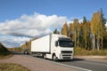 Autumn highway and white truck Royalty Free Stock Photo
