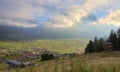 Autumn hillside scenery in the early morning with golden clouds embracing Mountain Zugspitze in the background Royalty Free Stock Photo