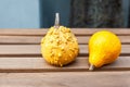 Autumn holiday concept. Bright decorative pumpkins on wooden table Royalty Free Stock Photo