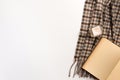 Autumn home cozy composition. Book and scarf, on white background Royalty Free Stock Photo