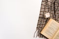 Autumn home cozy composition. Book and scarf, on white background Royalty Free Stock Photo