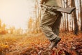 Autumn hunting season, hunter with rifle looking out for some wild animal in a wood or forest, outdoor sports concept Royalty Free Stock Photo