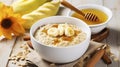 Autumn-Inspired Oatmeal with Banana, Honey, and Yogurt in a White Bowl on a Wooden Background
