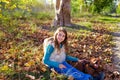 Autumn kid girl with pet dog relaxed in fall forest Royalty Free Stock Photo