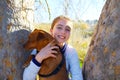 Autumn kid girl with pet dog relaxed in fall forest Royalty Free Stock Photo