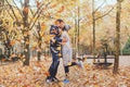 Autumn kiss, young loving couple in the park Royalty Free Stock Photo