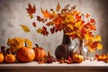 Autumn kitchen interior. Red and yellow leaves and flowers in the vase and pumpkin on light background Royalty Free Stock Photo