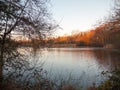 autumn lake scene outside sun set light space surface winter clear Royalty Free Stock Photo