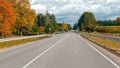 Autumn landscape with asphalt road and forest. Royalty Free Stock Photo