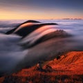 Autumn landscape, beautiful sunrise above the heavy clouds, Mountain sea