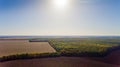 Autumn landscape: blue sky, colorful trees, yellow fields. Royalty Free Stock Photo