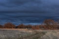 Autumn landscape with a blue stormy sky. A cyclone and heavy rain are coming Royalty Free Stock Photo