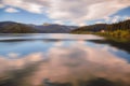 Autumn landscape with Bucegi mountains on Lake Bolboci, Bolboci dam, located in Romania Royalty Free Stock Photo