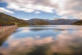 Autumn landscape with Bucegi mountains seen from dam Bolboci located in Romania Royalty Free Stock Photo