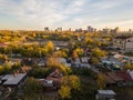 Autumn landscape on the city from the side of the ghetto with old dilapidated houses on the background of high Royalty Free Stock Photo