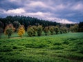 Autumn landscape with colorful forest and storm clouds Royalty Free Stock Photo