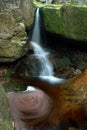 Autumn landscape, colorful leaves on trees, morning at river. Small waterfall. A misty morning near a picturesque river, Germany. Royalty Free Stock Photo