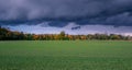 Autumn landscape with colorful trees and storm clouds Royalty Free Stock Photo