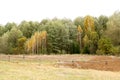 Autumn landscape. Dark clouds over the autumn forest. Yellowed grass in the field. Royalty Free Stock Photo