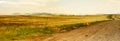 Autumn landscape, dirt road in the steppe, wide panorama Royalty Free Stock Photo