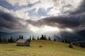 Autumn landscape with dramatic sky and sun rays