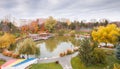 Autumn landscape of Drumul Taberei Park in Bucharest city capital of Romania with cloudy sky and great fall colors Royalty Free Stock Photo