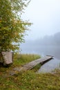 Autumn landscape in the early foggy morning on a beautiful lake with water lilies. Royalty Free Stock Photo