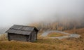 Autumn landscape in the forest. wooden log cabin at the valley. Yellow trees. Fall season Royalty Free Stock Photo